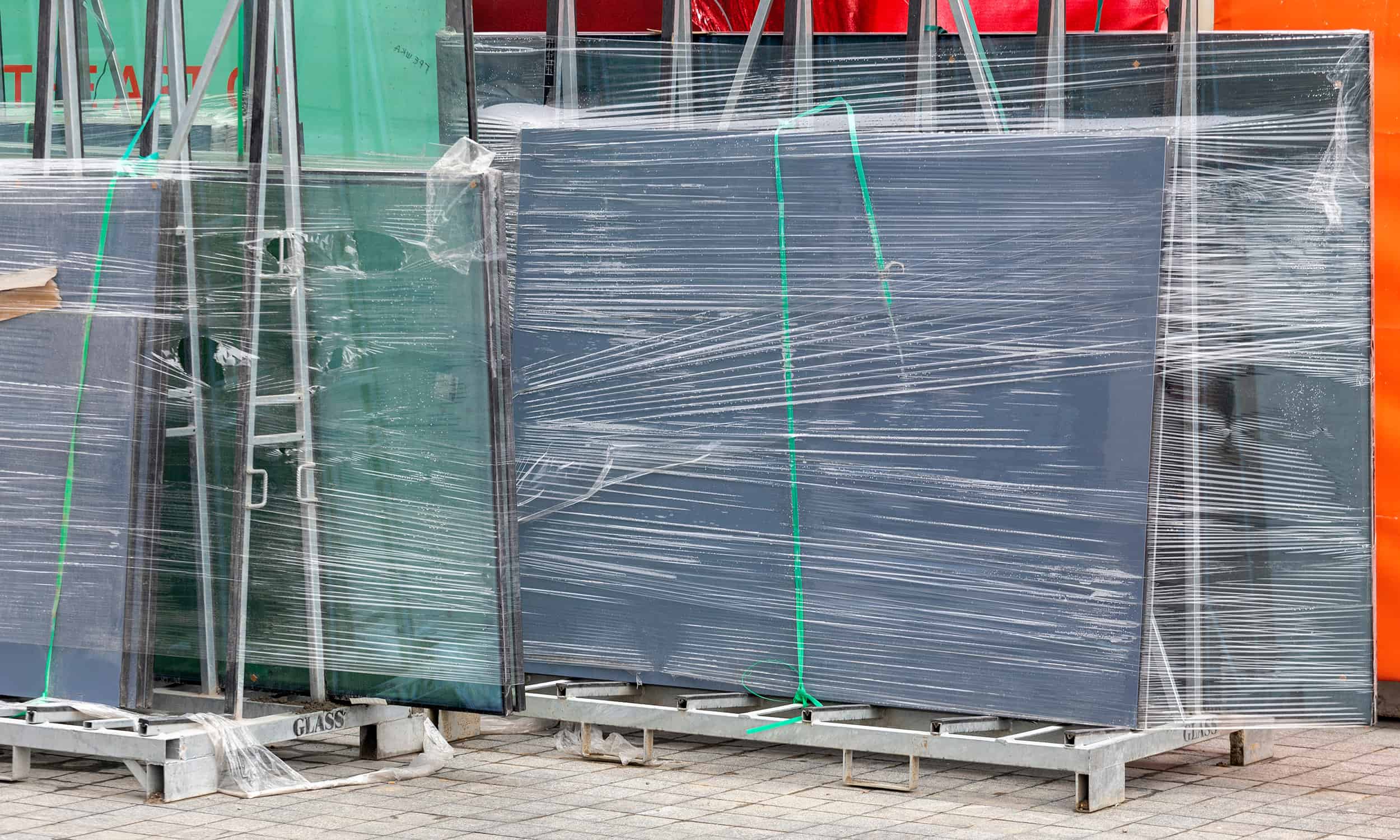 glass sheets on glass racks in a manufacturing facility